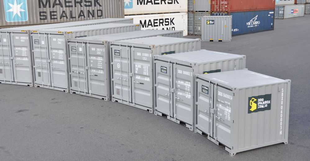 A row of shipping containers in different sizes
