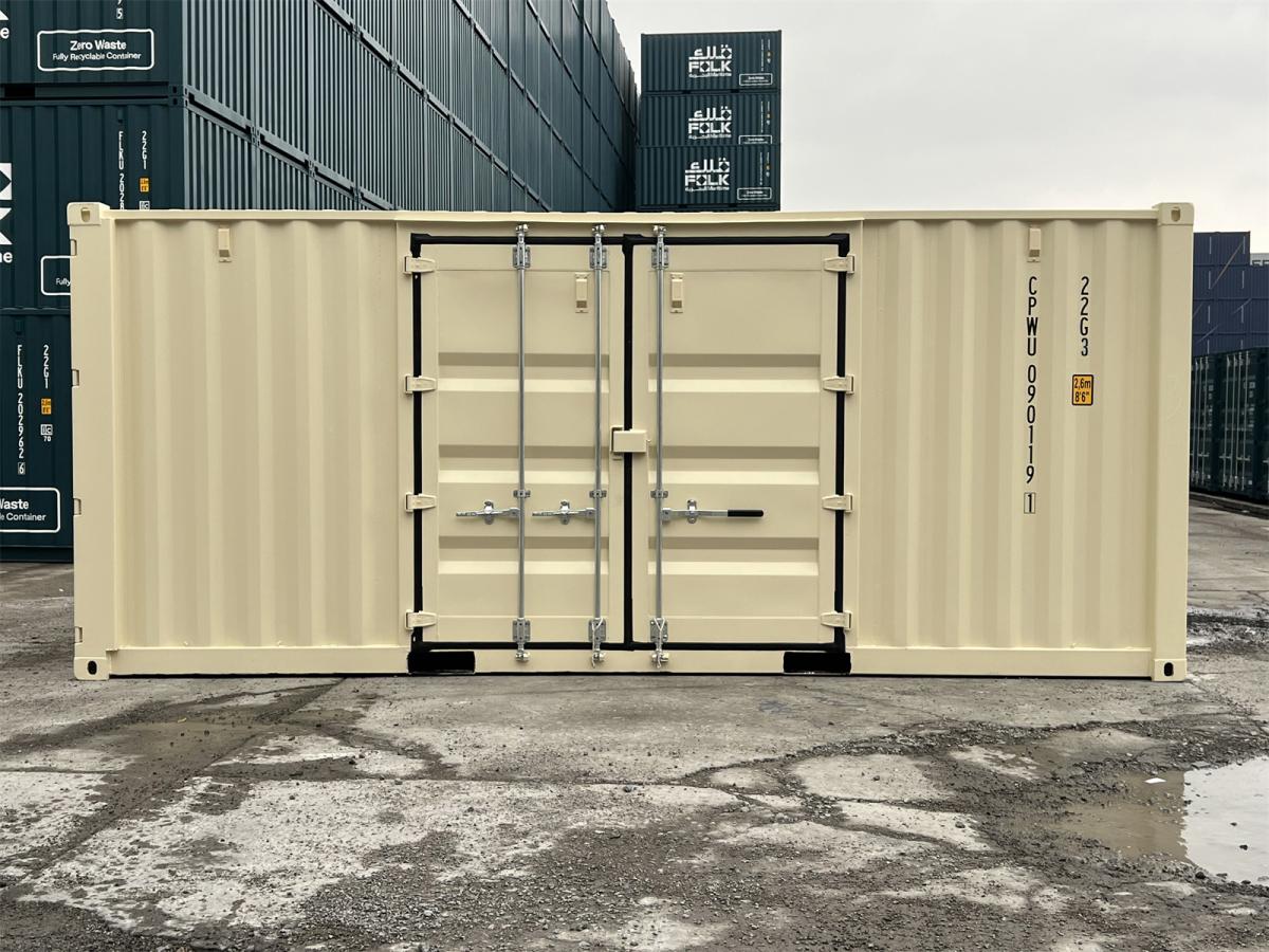 A wide, side-profile view of the ivory shipping container, highlighting the closed double doors centered on its long side panel. The container code "CPWU 090119 1" is printed vertically on the right side. Large stacks of teal shipping containers form a dense background.